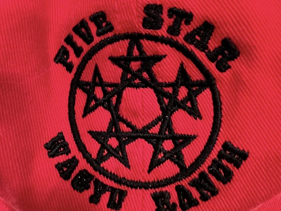A cap embroidered with the Five Star Wagyu Ranch brand, five stars set in a circle